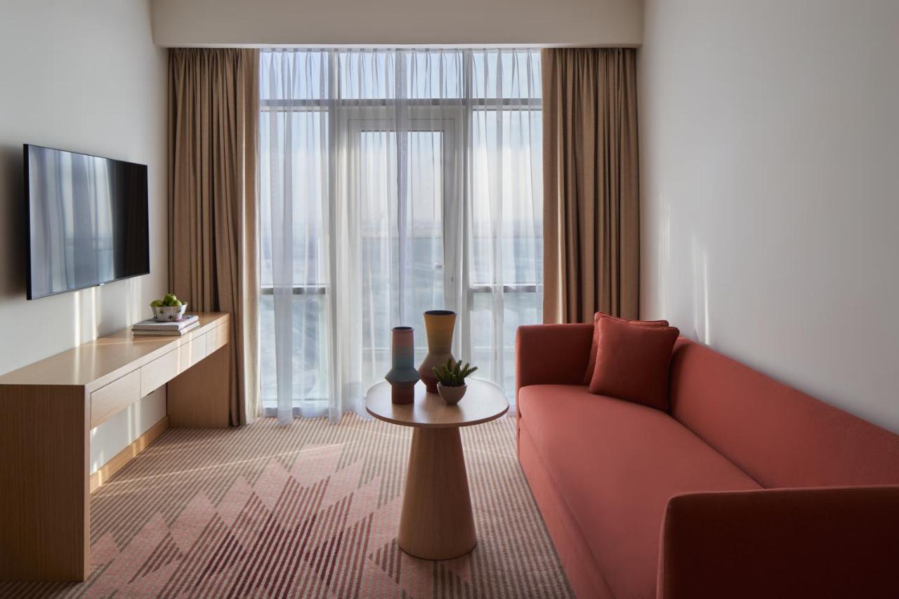 Novotel Jumeirah Village Triangle Дубай Екстериор снимка