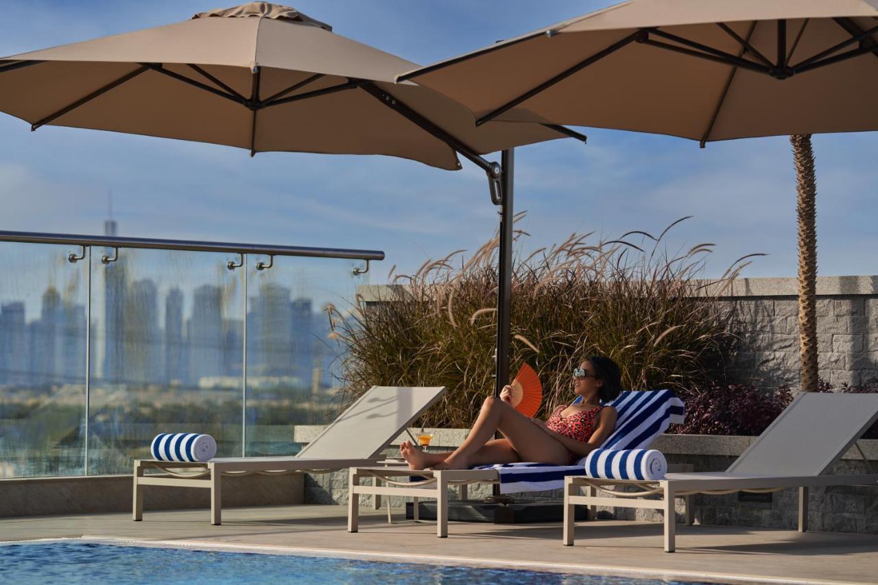 Novotel Jumeirah Village Triangle Дубай Екстериор снимка