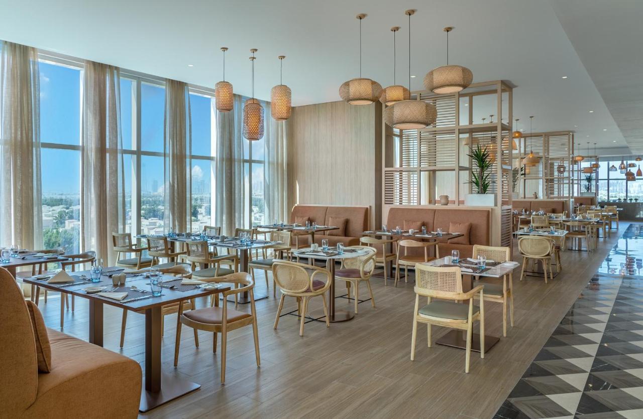 Novotel Jumeirah Village Triangle Дубай Екстериор снимка