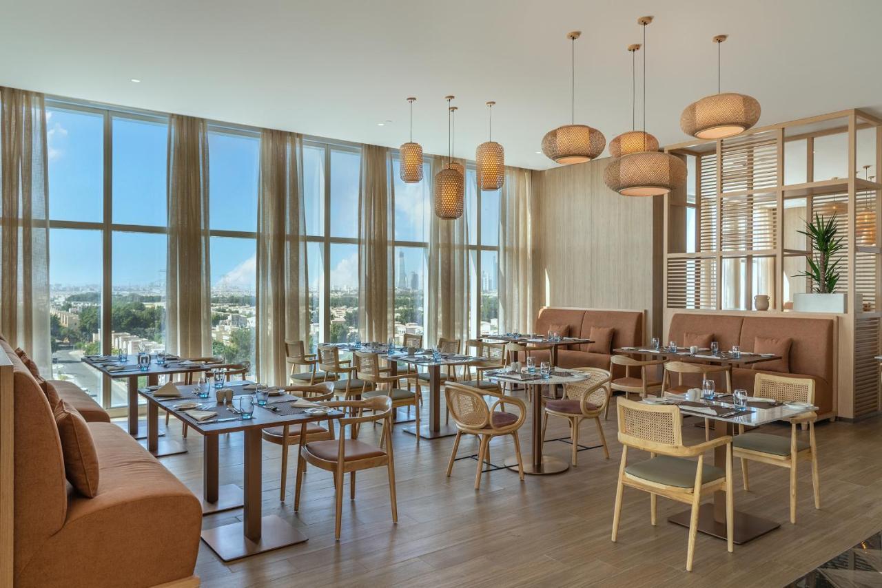 Novotel Jumeirah Village Triangle Дубай Екстериор снимка