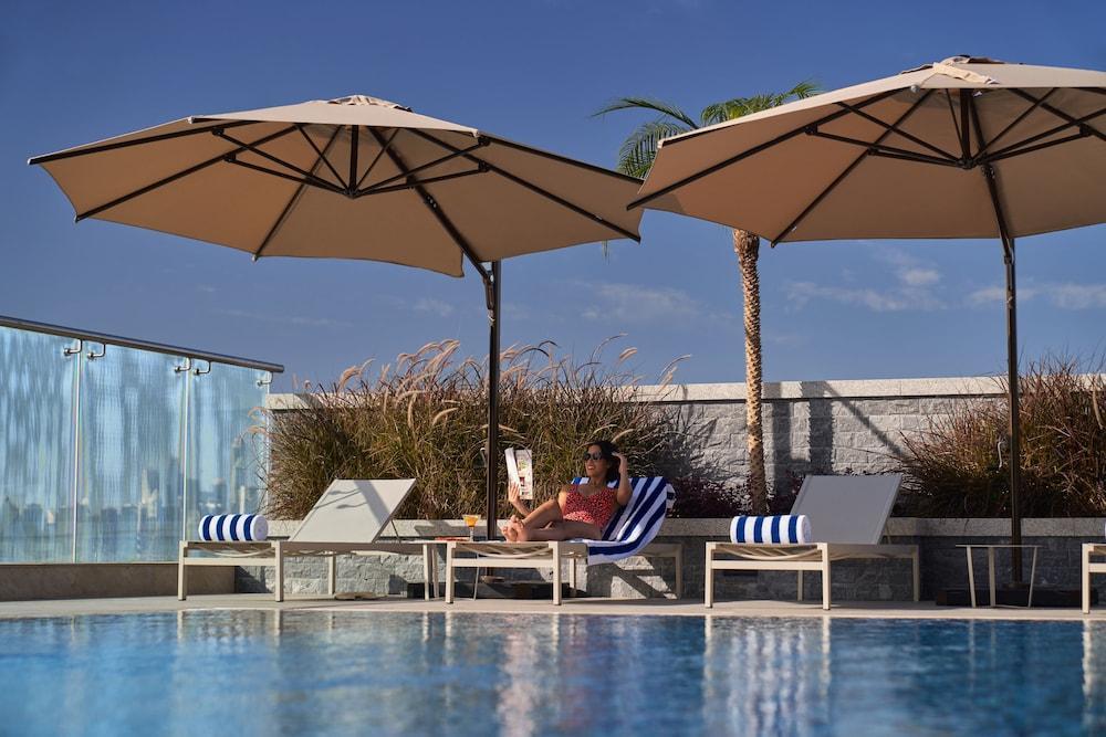 Novotel Jumeirah Village Triangle Дубай Екстериор снимка